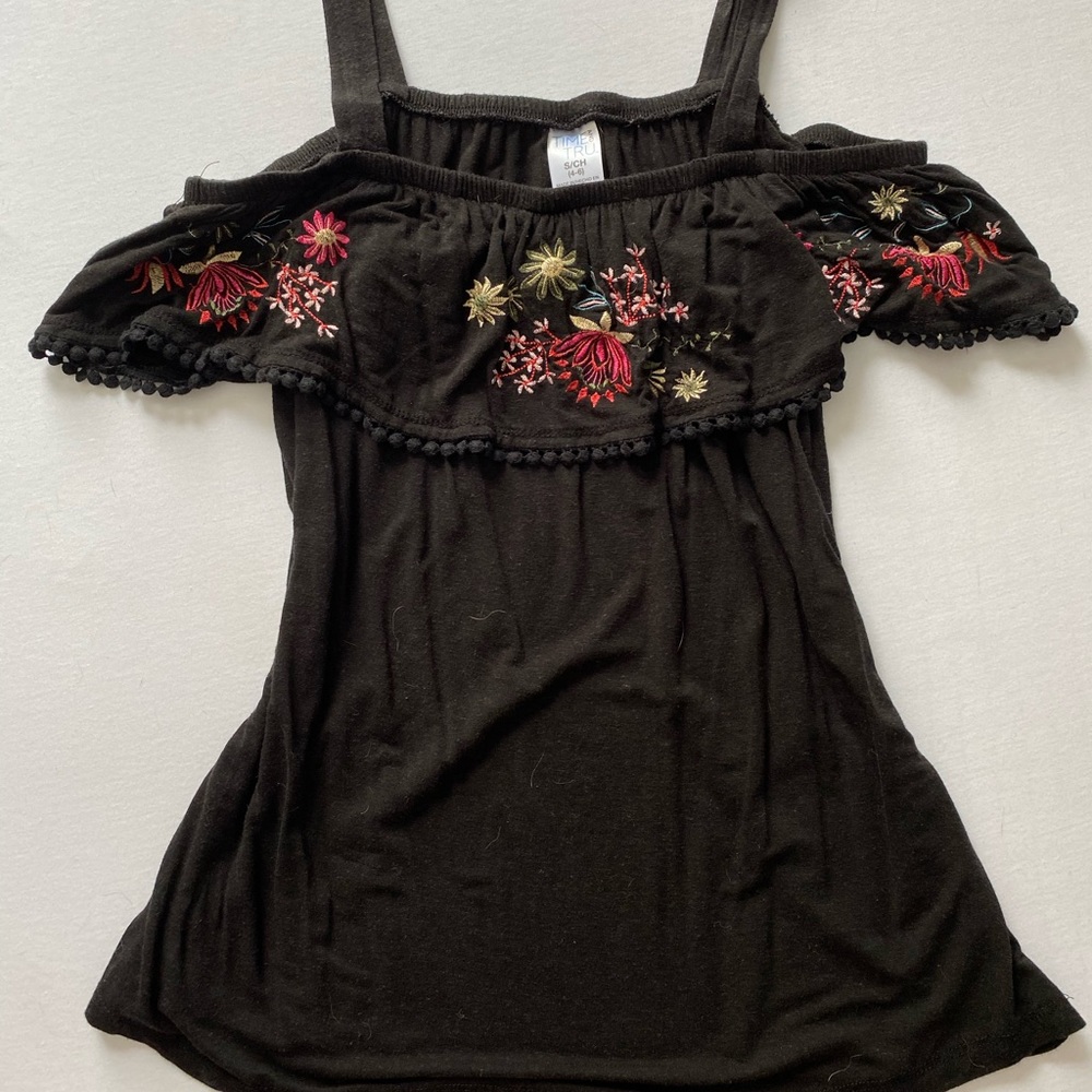 Floral off the shoulder top with straps.